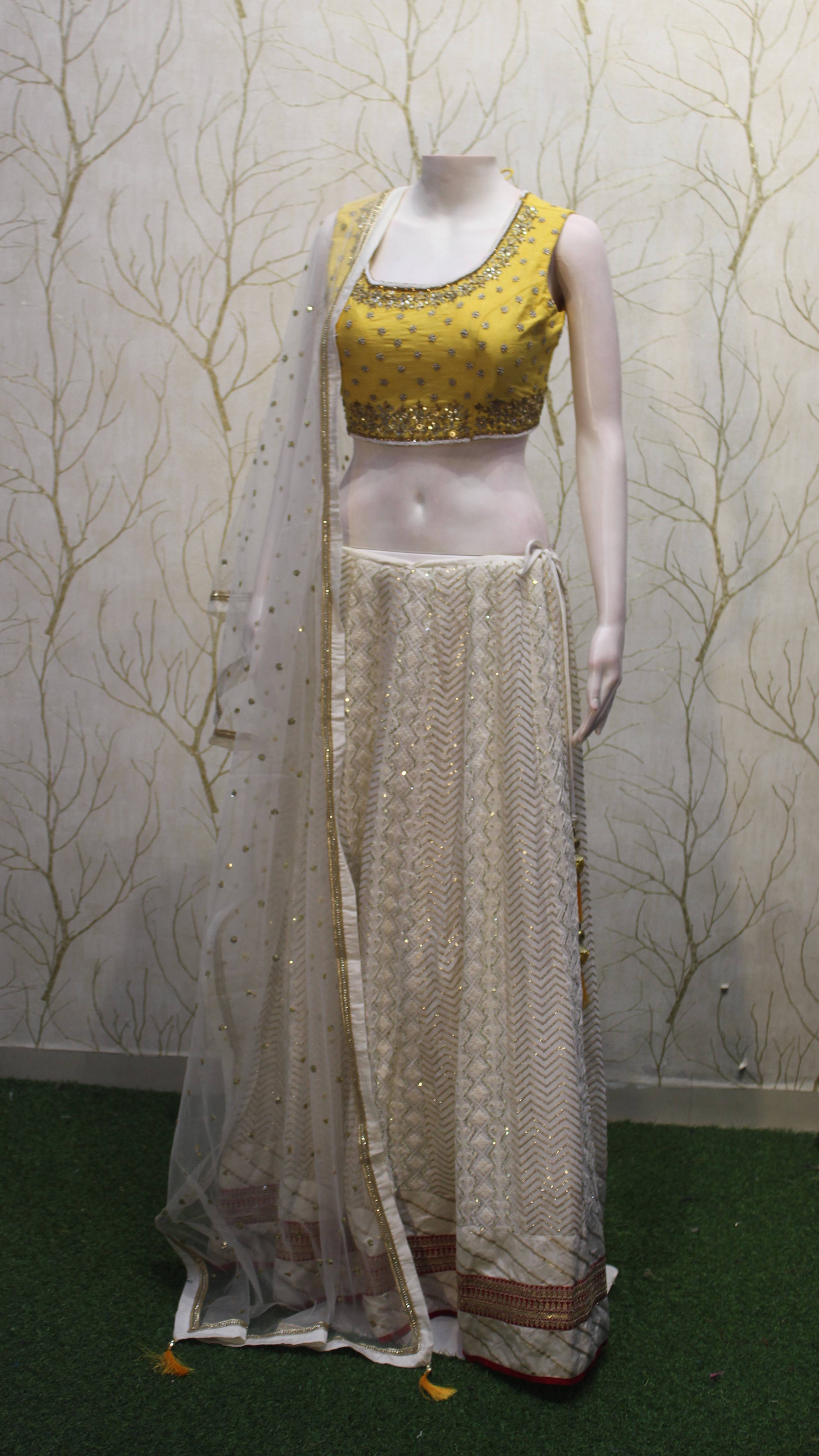 Yellow Embroidered Blouse with Cream Designer Lehenga Set