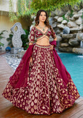 Maroon designer Chaniya Choli with gold weaving and dupatta