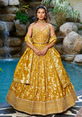 Mustard yellow designer Chaniya Choli with gold weaving and dupatta