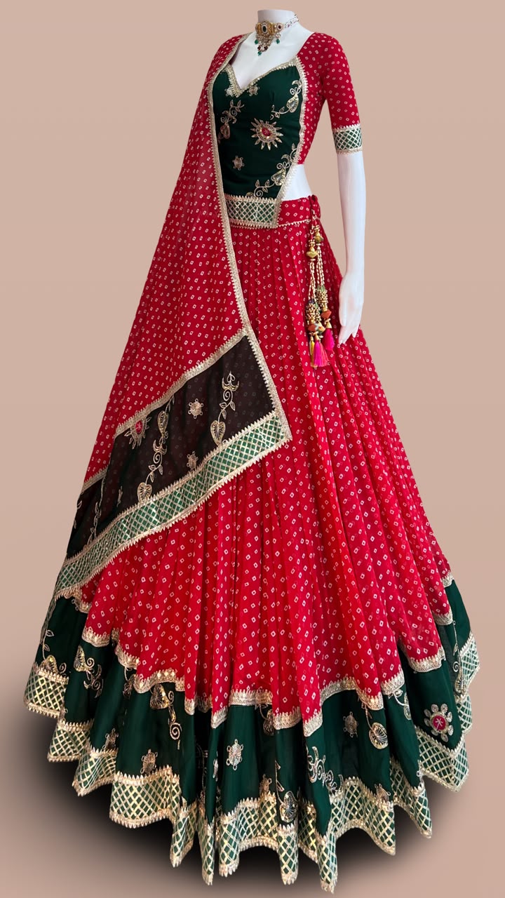 Red and green designer Bandhani Chaniya Choli with embroidered dupatta for Navratri 2026