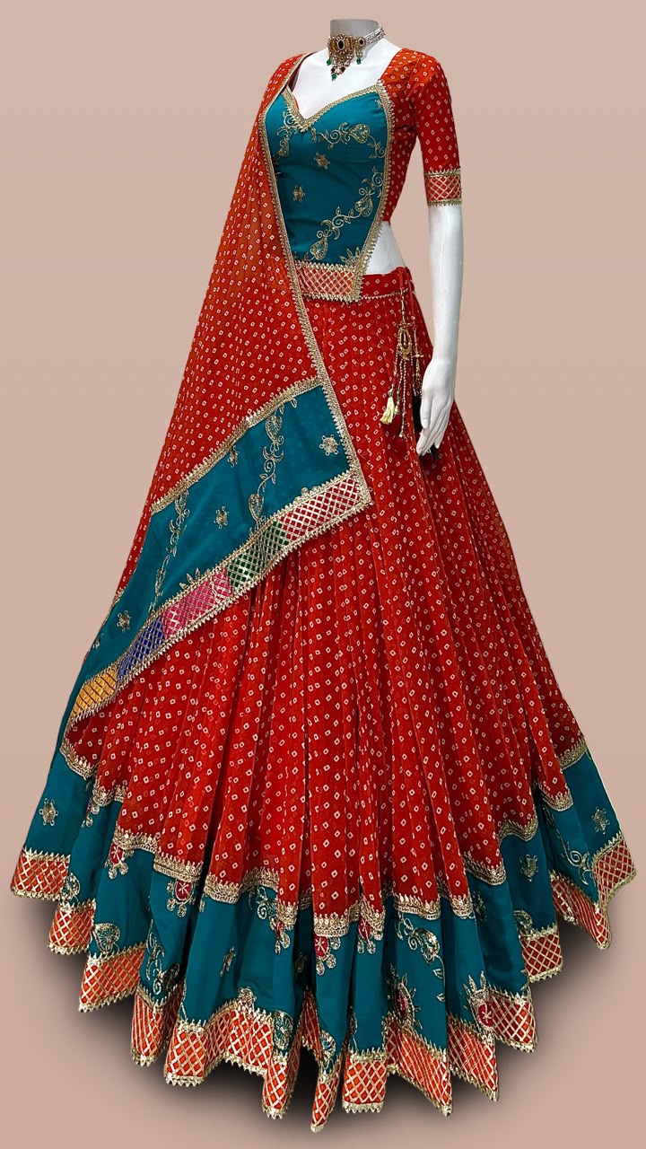 Red and teal designer Bandhani Chaniya Choli with embroidered dupatta for Navratri 2026